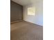 Standard bedroom features neutral carpet and a unique design wall at 4663 S Fraser Ct # C, Aurora, CO 80015