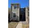 Charming townhome with a well-maintained front yard and neutral-toned siding, offering a welcoming curb appeal at 4663 S Fraser Ct # C, Aurora, CO 80015