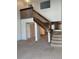 Spacious foyer boasts a staircase, neutral carpet, and ample natural light at 4663 S Fraser Ct # C, Aurora, CO 80015