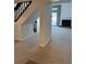 Open-concept living space with staircase, fireplace, and abundant natural light at 4663 S Fraser Ct # C, Aurora, CO 80015