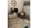 Stylish living room features a mirrored credenza and unique accent chair at 4663 S Fraser Ct # C, Aurora, CO 80015