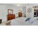 Cozy bedroom with a bed, mirror dresser, ceiling fan, and carpeted floors at 11440 E Martin Luther King Jr Blvd, Denver, CO 80238