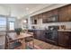 Bright, open kitchen featuring modern cabinets, a dining area, and stainless steel appliances at 11440 E Martin Luther King Jr Blvd, Denver, CO 80238