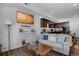 Inviting living room featuring open floor plan, stylish decor, and sleek white shelving at 11440 E Martin Luther King Jr Blvd, Denver, CO 80238