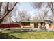 Inviting backyard with a rectangular pool, patio seating, well-maintained lawn, and attractive landscaping at 3050 S Marion St, Englewood, CO 80113