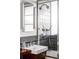 Modern bathroom showcasing tiled shower, chrome fixtures, and vanity sink at 3050 S Marion St, Englewood, CO 80113