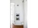 Hallway nook features an old telephone and built-in bookshelf at 3050 S Marion St, Englewood, CO 80113