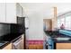 Kitchen showcasing stainless steel refrigerator, hardwood floors, and a unique oven range at 3050 S Marion St, Englewood, CO 80113