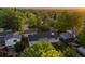 Back aerial view of the residence showing mature landscaping with lawns and many mature trees in the neighborhood at 9346 Flower St, Broomfield, CO 80021