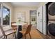 Bright breakfast nook with stylish table, chairs, and laundry closet at 9346 Flower St, Broomfield, CO 80021