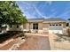 Charming single-story home featuring a well-maintained lawn, neutral toned exterior, and attached one car garage at 9346 Flower St, Broomfield, CO 80021