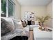 Cozy living room adorned with decorative pillows, throw blanket, and artwork at 9346 Flower St, Broomfield, CO 80021