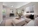 Bright living room featuring a large sectional, stylish decor, and an abundance of natural light at 9346 Flower St, Broomfield, CO 80021