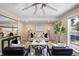 Bright living room with stylish furniture, ceiling fan, and view from large window at 9346 Flower St, Broomfield, CO 80021