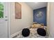 Cozy playroom with a blue accent wall, a small table and chairs, and decorative wall art at 9346 Flower St, Broomfield, CO 80021