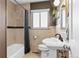Cozy bathroom with stylish vanity, bathtub and shower combination, and tiled walls at 2120 N Poplar St, Denver, CO 80207