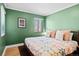 Bright bedroom with hardwood floors, a window, and neutral walls at 2120 N Poplar St, Denver, CO 80207