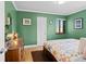 Bright bedroom with hardwood floors, a window, and neutral walls at 2120 N Poplar St, Denver, CO 80207