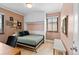 Cozy bedroom featuring a built-in Murphy bed and a collection of charming wall art at 2120 N Poplar St, Denver, CO 80207