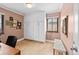 Bedroom with a built-in storage cabinet and a comfortable seating area at 2120 N Poplar St, Denver, CO 80207