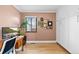 Bedroom featuring an open design, built-in cabinets, and a cozy desk area at 2120 N Poplar St, Denver, CO 80207