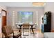 Bright dining room with hardwood floors and ample natural light at 2120 N Poplar St, Denver, CO 80207