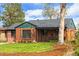 Charming brick home with well-manicured lawn and inviting curb appeal at 2120 N Poplar St, Denver, CO 80207