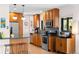 Modern kitchen with stainless steel appliances, wooden cabinets, and natural light at 2120 N Poplar St, Denver, CO 80207