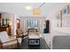 Bright living space with a dining area featuring a large window and comfortable seating at 2120 N Poplar St, Denver, CO 80207