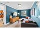Stylish living room with modern sectional sofa, lots of sunlight and contemporary decor at 2120 N Poplar St, Denver, CO 80207
