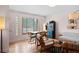 Well-lit living and dining space featuring hardwood floors and modern decor at 2120 N Poplar St, Denver, CO 80207