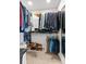 Spacious walk-in closet with ample shelving and hanging space for organized storage at 2120 N Poplar St, Denver, CO 80207
