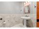 Powder bathroom featuring a vessel sink, pendant lights, and tile wall accents at 1988 Lake Dr, Larkspur, CO 80118