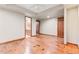Bedroom features hardwood floors, neutral paint, and access to the kitchen at 1988 Lake Dr, Larkspur, CO 80118