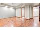 Bright bedroom features hardwood floors, neutral paint, and an en-suite walk-in closet at 1988 Lake Dr, Larkspur, CO 80118