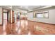 Large bonus room with hardwood floors and a view of the back of the house at 1988 Lake Dr, Larkspur, CO 80118