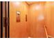 Interior view of the elevator in the home, which is paneled in wood at 1988 Lake Dr, Larkspur, CO 80118