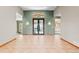 Spacious foyer with tile flooring and an elegant decorative front door at 1988 Lake Dr, Larkspur, CO 80118