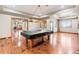 Spacious game room showcasing a pool table, hardwood floors, and recessed lighting at 1988 Lake Dr, Larkspur, CO 80118
