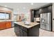 Kitchen with stainless steel appliances, central island, and an open layout at 1988 Lake Dr, Larkspur, CO 80118