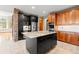A modern kitchen features granite countertops, stainless steel appliances, and tile flooring at 1988 Lake Dr, Larkspur, CO 80118