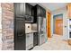 Kitchen featuring stainless steel appliances, granite countertops, and custom cabinetry at 1988 Lake Dr, Larkspur, CO 80118