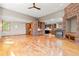 Spacious living room with hardwood floors, a fireplace, and an open floor plan at 1988 Lake Dr, Larkspur, CO 80118