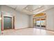 Living room with neutral walls, trey ceiling, recessed lights, and access to a patio at 1988 Lake Dr, Larkspur, CO 80118