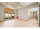 Large living area with tray ceilings, recessed lighting, and access to the covered patio at 1988 Lake Dr, Larkspur, CO 80118