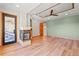 Bright living room with wood flooring, a modern fireplace, and large windows for ample natural light at 1988 Lake Dr, Larkspur, CO 80118