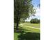 Well-maintained walking path through a green community area at 2708 Syracuse St # 109, Denver, CO 80238