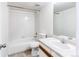Bathroom with tile surround bathtub and shower combination, with a single sink vanity at 9182 Weeping Willow Ct, Highlands Ranch, CO 80130