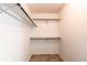Neutral closet with built in shelving at 9182 Weeping Willow Ct, Highlands Ranch, CO 80130