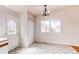 Cozy dining room with elegant lighting fixture and bright windows at 9182 Weeping Willow Ct, Highlands Ranch, CO 80130